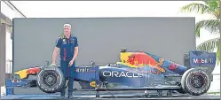  ?? VIJAY BATE /HT PHOTO ?? David Coulthard, 13-time F1 race winner, poses with Red Bull’s RB7 in Mumbai.