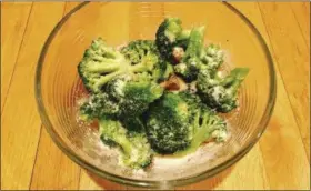  ?? ELIZABETH KARMEL VIA AP ?? Broccoli with a dusting of parmesan cheese and roasted garlic