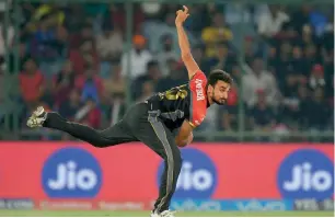  ?? — AFP ?? RCB’s Harshal Patel bowls during the match against Delhi Daredevils at the Feroz Shah Kotla Stadium in New Delhi on Sunday.