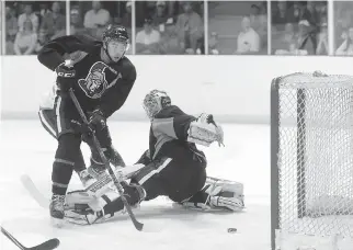  ?? JANA CHYTILOVA/OTTAWA CITIZEN ?? Senators prospect Nick Paul scores on Chris Driedger during a scrimmage at the Kanata Recreation Centre on Thursday. Paul is pencilled in to start next season in Binghamton.