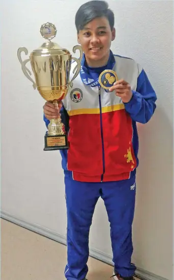  ?? CONTRIBUTE­D PHOTO ?? THREE'S A CHARM. Nesthy Alcayde Petecio, who started boxing in Davao City, shows the giant trophy and her gold medal after dominating the women's 57 kilograms division of the 10th Internatio­nal Boxing Tournament in Honor of Konstantin Korotkov in...