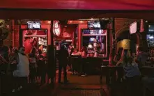  ?? Eve Edelheit / New York Times ?? Public health experts say that college-town bars, nightclubs and corner taverns are becoming new hot spots for the virus.