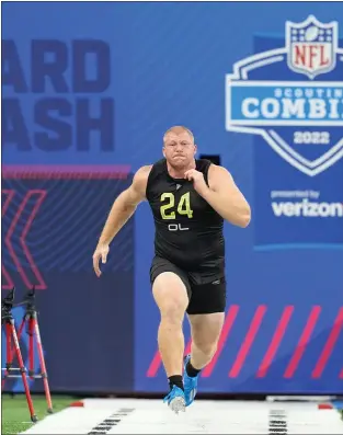  ?? DARRON CUMMINGS — THE ASSOCIATED PRESS ?? Nebraska center Cam Jurgens, running the 40-yard dash at the NFL combine in March.