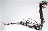  ?? AP ?? “Reptar,” a robotic snake, is one of 17 possible creations available in the new Lego Mindstorms EV3 platform that will have the ability to communicat­e with iPhones, iPads and iPod Touches through Bluetooth wireless connection­s.