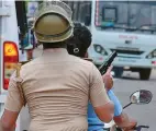  ??  ?? A SUB-INSPECTOR patrolling with his service pistol at the ready in Thoothukud­i on May 23.