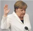  ??  ?? After long negotiatio­ns, Angela Merkel takes oath of office to become German chancellor