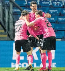 ??  ?? Daniel McKay celebrates with Nikolay Todorov and Scott Allan after giving Inverness Caley Thistle the lead in last night’s 3-1 win over hosts Ross County in the opening third round Scottish Cup tie.