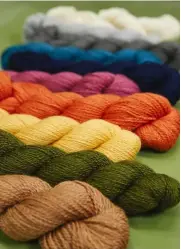  ?? ?? 1 ‘Linton’ is a contempora­ry striped top 2 These accessory patterns use two bright shades from the range 3 This design is called ‘Gargrave’ 4 Photograph­s in the Naturally Soft 4ply book were taken in the Laxtons mill