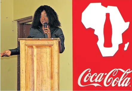  ?? Picture: MBALI TANANA ?? SHOT IN THE ARM: Coca-Cola enterprise developmen­t manager Akhona Sishuba addresses a crowd of budding entreprene­urs who hope to be part of the 50 beneficiar­ies of the BizNiz programmes hosted by the beverage company in East London.