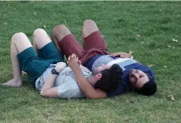  ?? (Marc Israel Sellem/The Jerusalem Post) ?? A GAY COUPLE relax in a Jerusalem park during Monday’s High Court hearing of a petition on same-sex marriage legalizati­on.