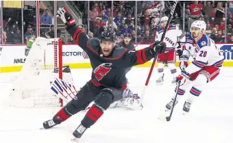  ?? Brendan Smith of the Hurricanes scores a short-handed goal in the second period against the Rangers. His first playoff goal in nine years would prove to be the game-winner. BRUCE BENNETT GETTY IMAGES ??