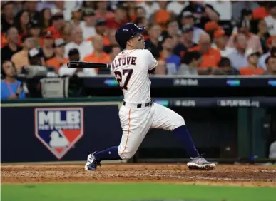  ?? Associated Press ?? Houston Astros' Jose Altuve watches his solo home run, his third of the game, against the Boston Red Sox in the seventh inning in Game 1 of baseball's American League Division Series on Thursday in Houston.