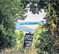  ??  ?? A sign near the village of South Heath in the Chiltern Hills where HS2 track will run