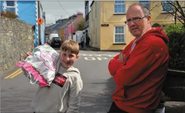  ??  ?? Micheál Ó Coileáin and his son, Ruadhán: The lockdown gives lots of time for reading, cooking, gardening and backyard football.