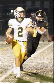  ?? BARRY BOOHER — FOR THE NEWS-HERALD ?? Amherst’s Christian Heckmann is pursued by Riverside’s Jason Ryan on Aug. 27.