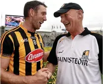  ??  ?? Paws for thought: Cats boss Brian Cody (right) and Michael Fennelly shake hands after Sunday’s final