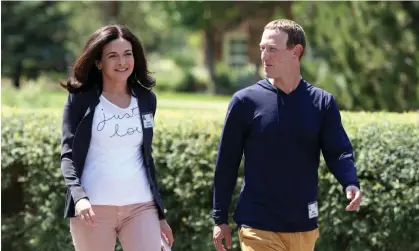  ?? ?? Sheryl Sandberg with Mark Zuckerberg, pictured last year. Photograph: Kevin Dietsch/Getty Images