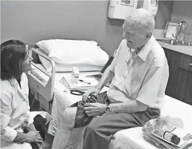  ?? THE NEWS JOURNAL ?? Avani Virani, of Bear, gives a checkup to John Witzel, 85, of Wilmington, at the St. Francis LIFE Center in Wilmington earlier this year. An AARP study found Delaware was 29th in meeting the long-term care needs of older or disabled residents.