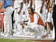  ?? WESLEY HITT/GETTY IMAGES/TNS 2021 ?? Texas coach Steve Sarkisian is savvy enough to know that signing one five-star quarterbac­k should never stop you from signing another one.