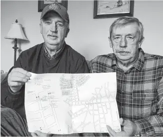  ?? ROSALIE MACEACHERN/SPECIAL TO THE NEWS ?? Buzz and Ed MacCallum with a map draegermen compiled to show where each the bodies of the 19 miners were found.