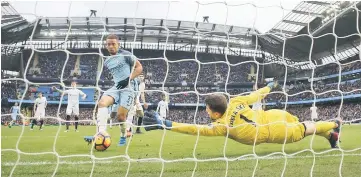  ?? — Reuters photo ?? Manchester City’s Gabriel Jesus scores their second goal during the English Premier League match between Manchester City and Swansea City at Etihad Stadium in Manchester.