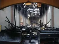  ?? AP Photo/Marcio Jose Sanchez ?? Q The interior of the San Gabriel Mission is damaged following a morning fire Saturday in San Gabriel, Calif. The fire destroyed the rooftop and most of the interior of the nearly 250-year-old California church that was undergoing renovation.