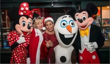  ??  ?? Mrs Claus with Disney Characters and Maria Walsh at Santa’s Enchanted Castle.