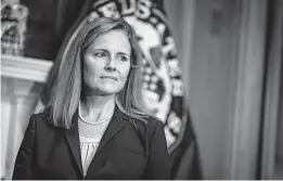  ?? SARAH SILBIGER/AP ?? Judge Amy Coney Barrett met with senators on Wednesday on Capitol Hill in Washington. Hearings for the Supreme Court nominee to replace Ruth Bader Ginsburg begin Oct. 12.