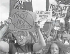  ?? WALT MANCINI, THE PASADENA STAR- NEWS, VIA AP ?? People rally in Los Angeles against the GOP. The Democratic National Committee has also had its servers exposed.