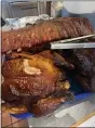  ?? SUBMITTED PHOTO ?? Barbecue ribs and smoked chicken wait to be served at Curley’s ‘Que in Spring City.
