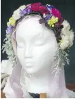  ??  ?? A floral tiara is designed for weddings, proms or other special occasions.