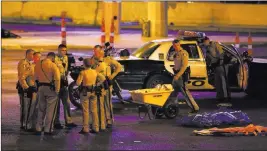  ?? Chase Stevens ?? Las Vegas Review-journal @csstevensp­hoto Las Vegas police gather after an active shooter situation that left 58 dead and more than 500 injured Oct. 1 on the Strip.