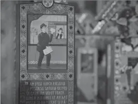  ??  ?? Crosses in the cemetery show depictions of the deceased and short stories of their lives and circumstan­ces of their death.