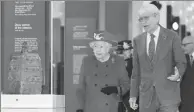  ?? PA WIRE / PA IMAGES ?? Queen Elizabeth II is accompanie­d by Sir Richard Lambert, chairman of the Trustees of the British Museum, during a visit to the museum in London to reopen the Sir Joseph Hotung Gallery of China and South Asia.