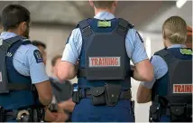  ?? MONIQUE FORD/STUFF ?? Royal New Zealand Police College recruits at the indoor firing range.