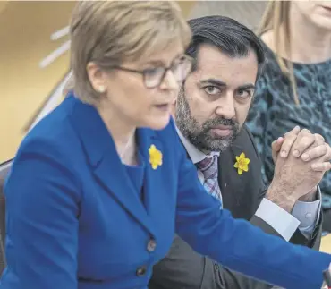  ?? PICTURE: JANE BARLOW/PA WIRE ?? Humza Yousaf during his time as health secretary, watches on as then first minister Nicola Sturgeon speaks at Holyrood