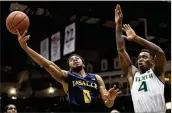  ?? CHRIS SZAGOLA / AP ?? La Salle’s Pookie Powell (left) tries to controlthe­ball as highly touted UM freshman Lonnie Walker IV stays close during his return to Reading, Pa.
