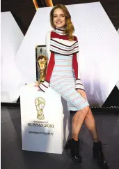  ?? AFP ?? Russian model Natalia Vodianova poses with the 2018 World Cup trophy at the Louis Vuitton headquarte­rs in Asnières- sur- Seine on Thursday. —