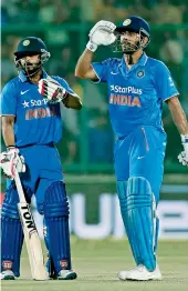  ??  ?? M.S. Dhoni (right) admitted that he made a mistake by opting to bowl on a sluggish wicket.