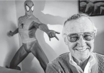  ?? Reed Saxon / Associated Press ?? In this April 16, 2002, file photo, Stan Lee, 79, creator of comic-book franchises such as “Spider-Man,” “The Incredible Hulk” and “X-Men,” smiles during a photo session in his office in Santa Monica, Calif.