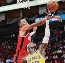  ?? Michael Wyke/Associated Press ?? Jabari Smith Jr., left, and the Rockets knocked down the Lakers on Wednesday, enabling the Pelicans to move within a half-game for a play-in spot.