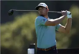  ?? RYAN KANG — THE ASSOCIATED PRESS ?? Sam Burns tees off on the ninth hole during the second round of the Genesis Invitation­al at Riviera Country Club on Friday in the Pacific Palisades area of Los Angeles.