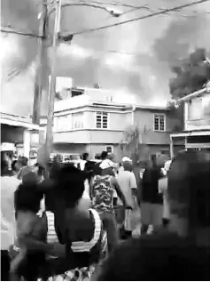  ?? — AFP photo ?? Video grab released by People’s Progressiv­e Party Civic of a fire coming from a prison compound in Geogetown, Guyana.