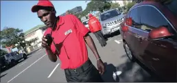  ??  ?? Florida Road sidewalk monitors, Sabelo Nzuza and Chagonda Tinoedzwa, were issued with a new set of uniforms by the Florida UIP.