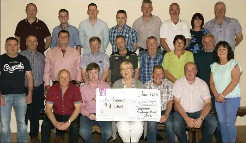  ??  ?? Castle Vintage Club present a cheque for €13,050 to Yvonne Boland of the The Friends of St Luke’s, the proceeds of their Tractor Run to Donegal.
