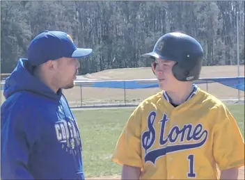  ?? SUBMITTED PHOTO ?? Thomas Stone first-year head baseball coach Robbie Zayas, left speaks to freshman second baseman Colin Headley in last Thursday’s home scrimmage versus St. Mary’s Ryken. After a one-year hiatus of fielding a varsity team due to low numbers, Stone...