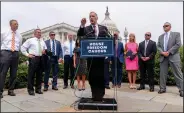  ??  ?? Rep. Andy Biggs, R-Ariz., (center) chairman of the House Freedom Caucus, accompanie­d by other members of the caucus, speaks Thursday at a news conference on Capitol Hill in Washington to complain about Speaker of the House Nancy Pelosi, D-Calif., and masking policies.
(AP/Andrew Harnik)