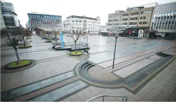  ?? (Wolfgang Rattay/Reuters) ?? KENNEDY SQUARE in Essen, Germany seen deserted last week due to the coronaviru­s lockdown.