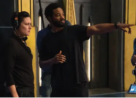  ??  ?? Team CaptainHel­mer Ryan Coogler works on the set of Marvel Studios’ “Black Panther” with cinematogr­apher Rachel Morrison.