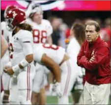  ?? THE ASSOCIATED PRESS ?? Alabama coach Nick Saban watches players warm up before Monday night’s national championsh­ip game against Georgia in Atlanta. The game ended too late for this edition but check out www.trentonian.com for details.